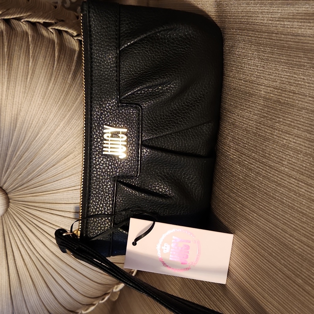 Juicy Couture NWT Wristlet Black. Lined, zipper pocket inside, card holders